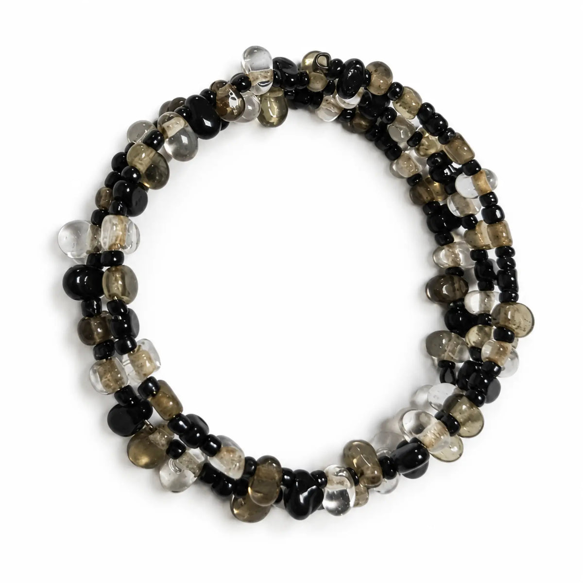 Top view of black clear and smoky multi-strand bracelet