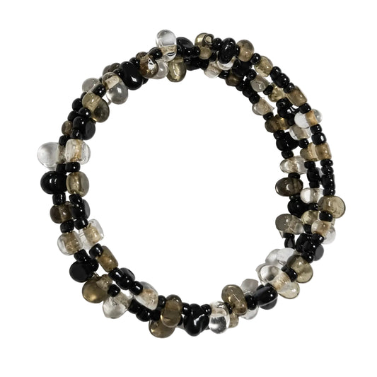 Top view of black clear and smoky multi-strand bracelet