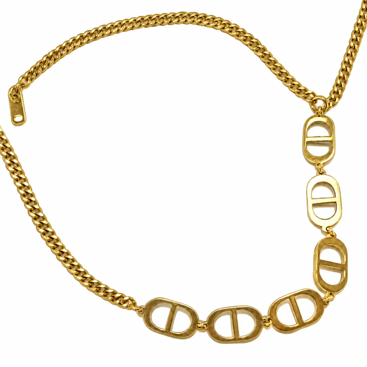 Natural close-up of six gold-tone oval-bar necklace links
