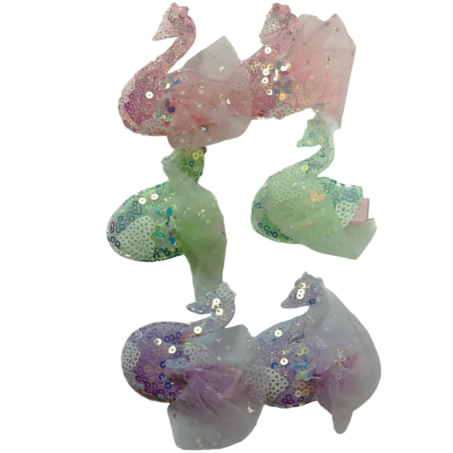 Colorful sequin and tulle bow on a white background