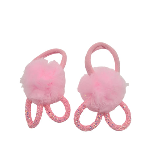 A pair of purple hair elastics with faux fur and glitter on a white background.