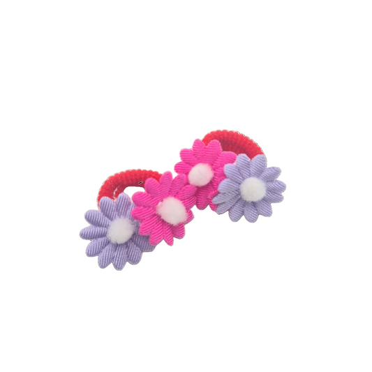 Set of three floral hair ties in pink, purple, and red on a white background
