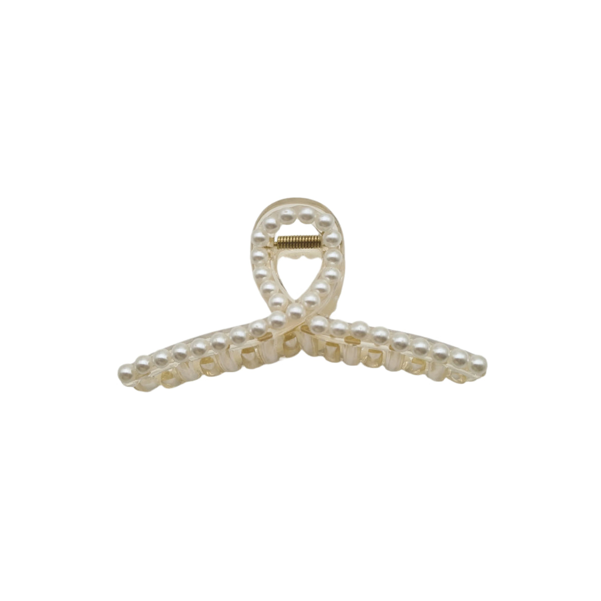 A white hair clip with a heart-shaped ornament and pearl accents