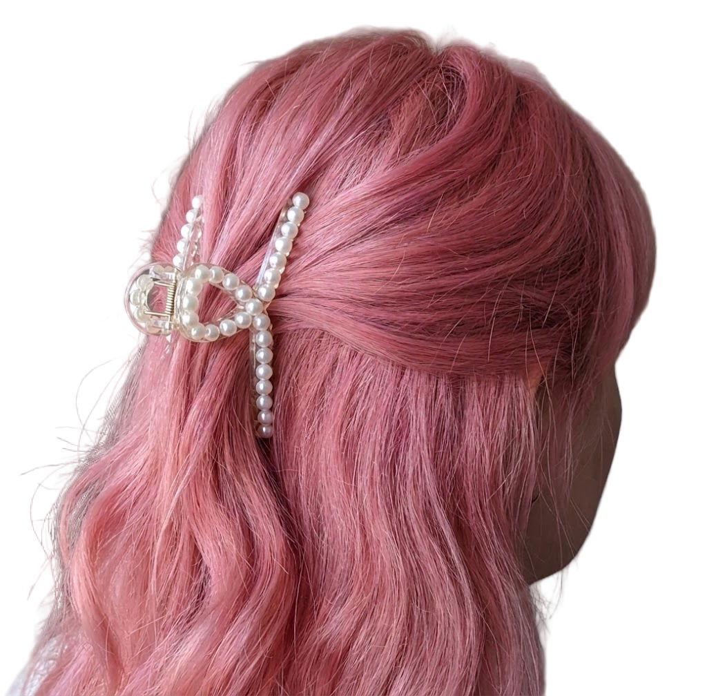 White hair clip with a heart-shaped ornament and pearl accents