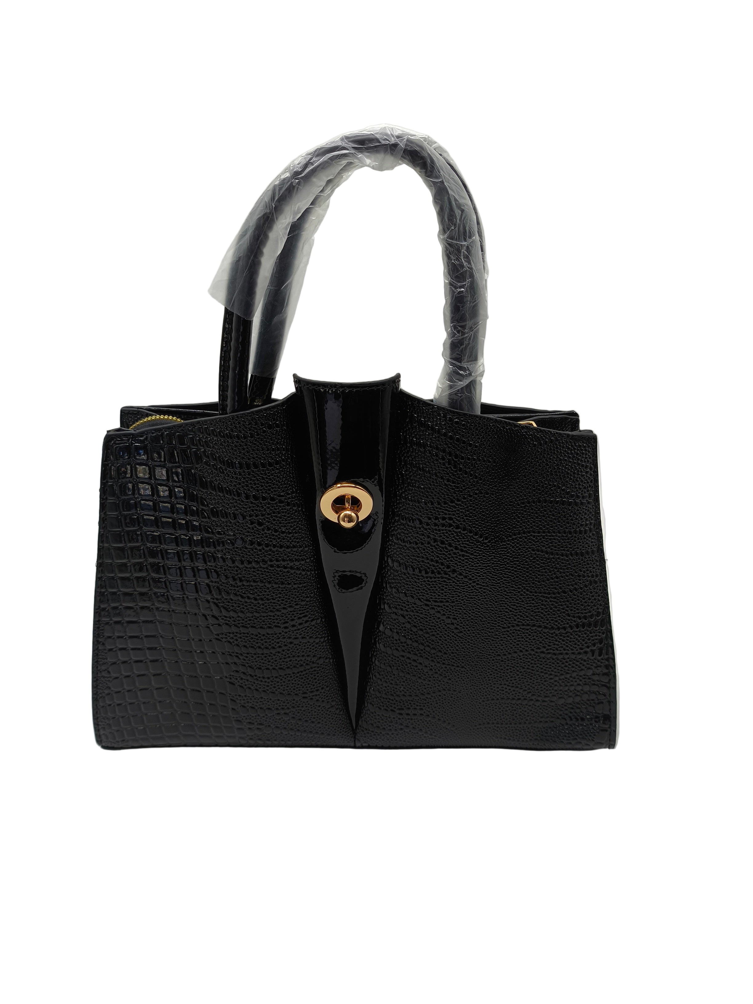 Black handbag with a gold clasp on a white background