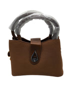 Load image into Gallery viewer, Brown handbag with a decorative handle on a white background
