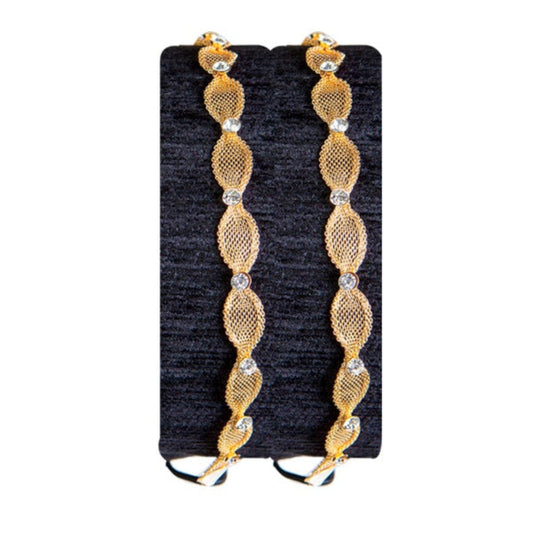 A set of metallic gold-colored hair extensions with strass embellishments, presented on a black surface.