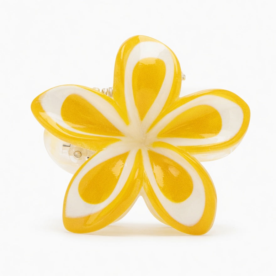 Yellow flower-shaped object on a white background