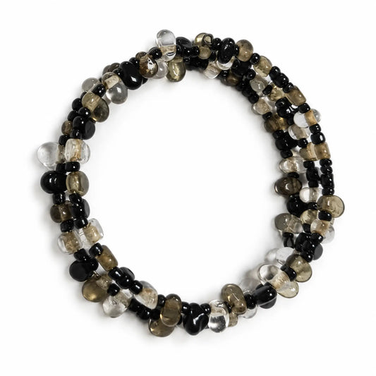 Top view of black clear and smoky multi-strand bracelet