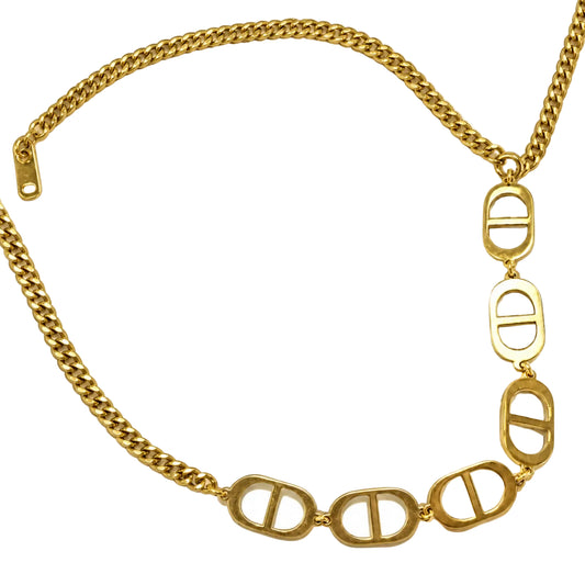 Natural close-up of six gold-tone oval-bar necklace links