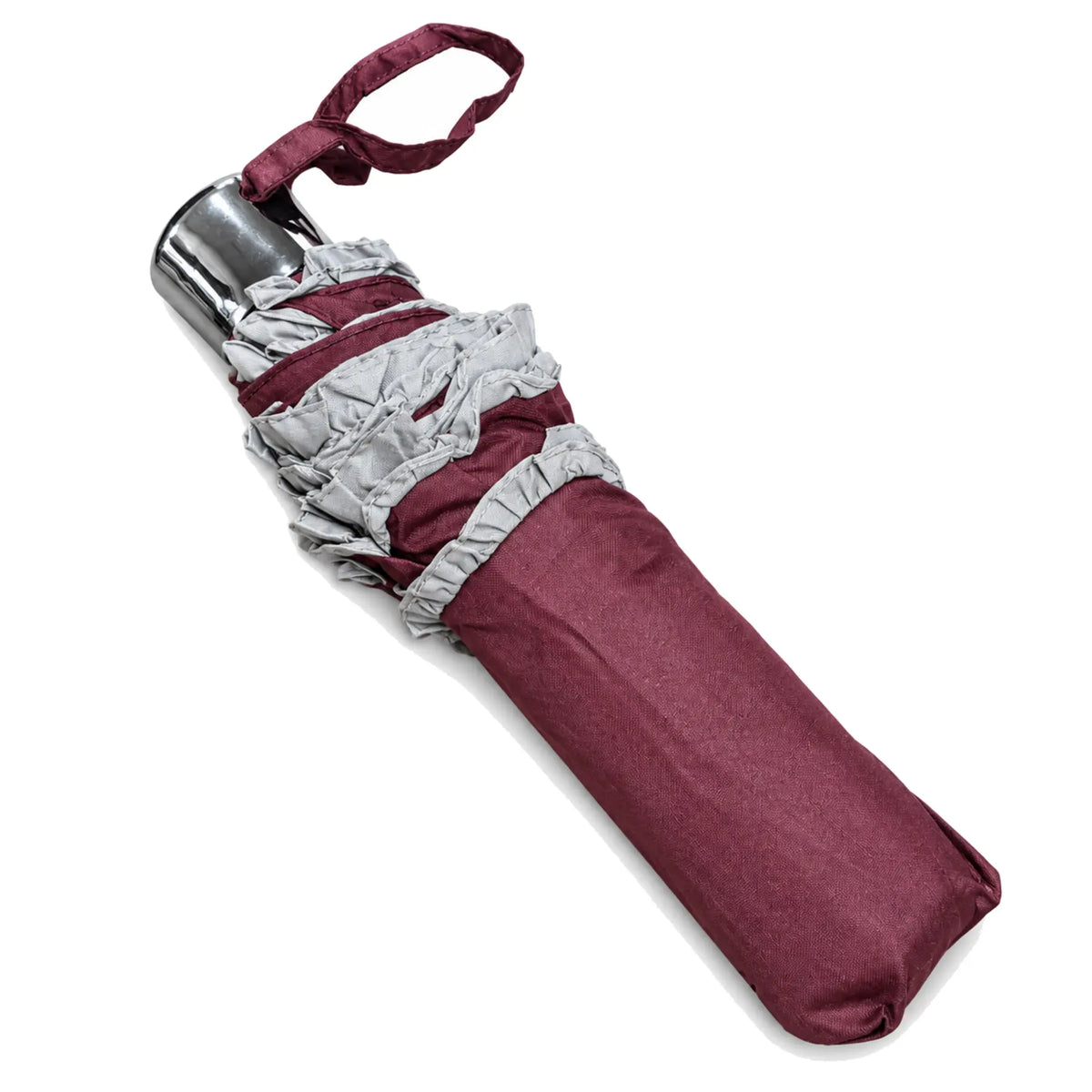 Folded burgundy ruffled compact umbrella on pure white background