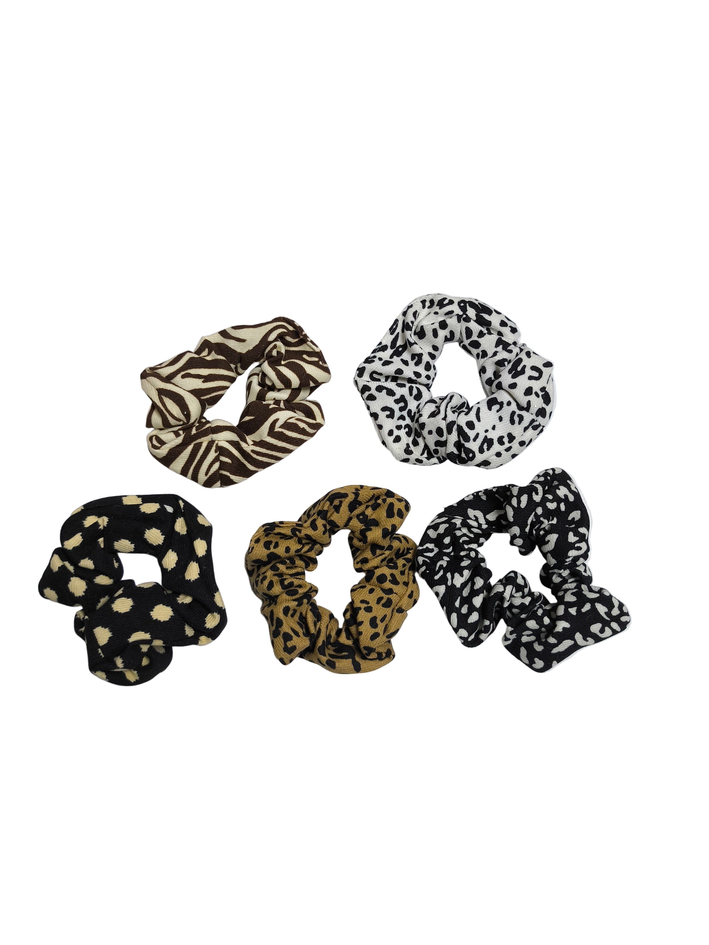 Set of five patterned scrunchies on a white background