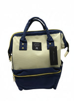 Load image into Gallery viewer, Navy and beige backpack with a visible brand tag on a white background
