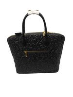 Load image into Gallery viewer, Black textured handbag with gold accents on a white background
