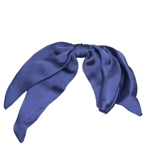 Blue hair bow in a white box