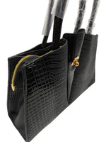 Load image into Gallery viewer, Black textured handbag with gold accents on a white surface
