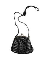 Load image into Gallery viewer, Black handbag with white polka dots on a white background
