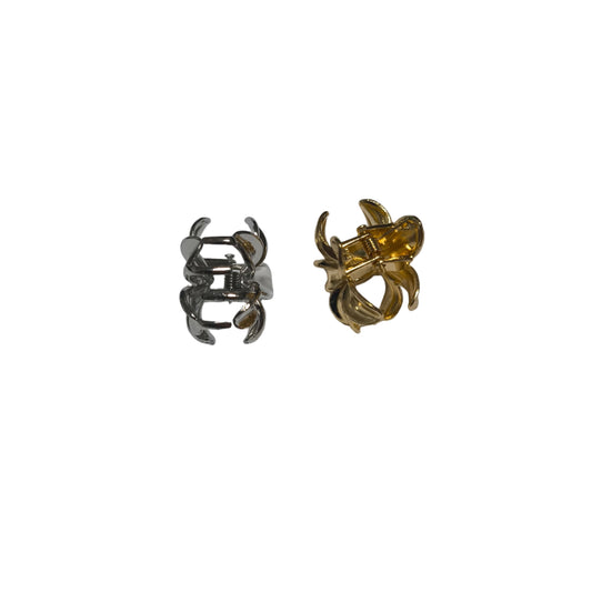 Pair of gold and silver ring-shaped earrings on a white background