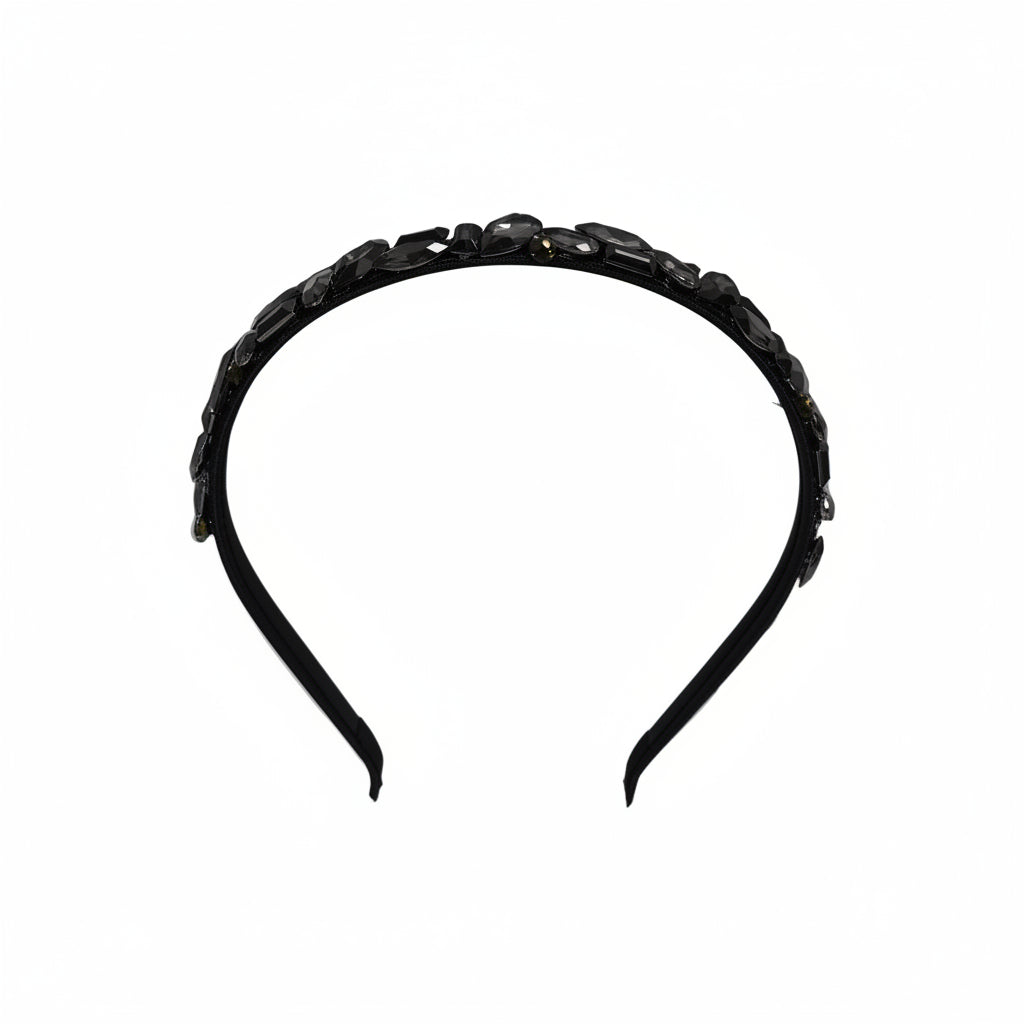Black headband with decorative elements on a white background