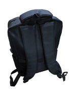 Load image into Gallery viewer, Black backpack on a cluttered desk with various items in the background
