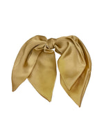 Load image into Gallery viewer, Gold scarf with a bow on a white surface
