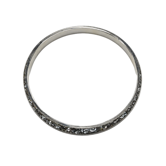 Women's slim silver-tone bangle with dark crystal-chip channel, top view